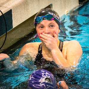 Swimmer surprised at the end of a race